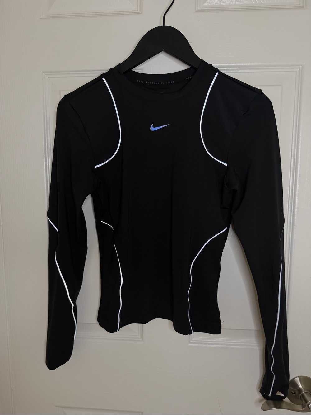 Nike Black Long-Sleeve Performance Top with White Piping and Blue Swoosh